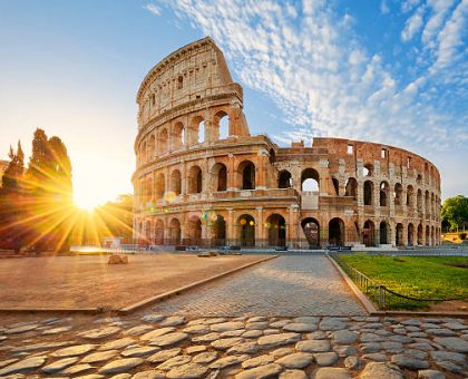 View of Colosseum in Rome and morning sun, Italy, Europe.